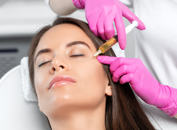 Cosmetologist does revs pro 32 therapy on the face of a beautiful woman in a beauty salon. Women's cosmetology in the beauty salon.